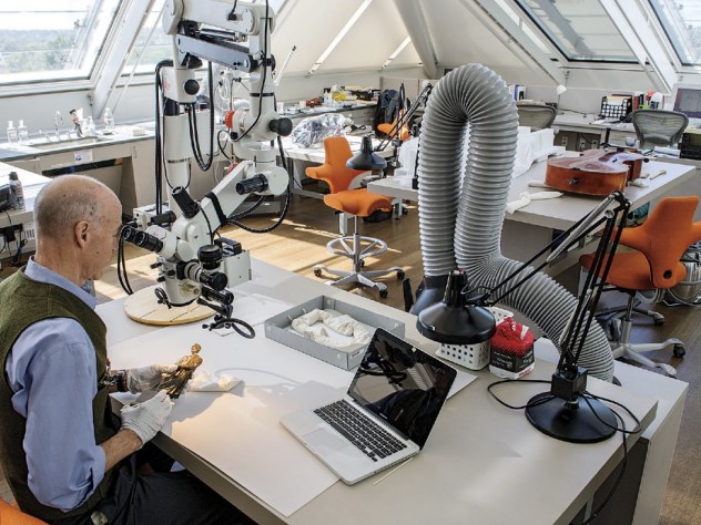 Photograph by Jim Harrison Straus Center for Conservation and Technical Studies director Henry Lie ’76 at work on a replica of a bronze in the collection.