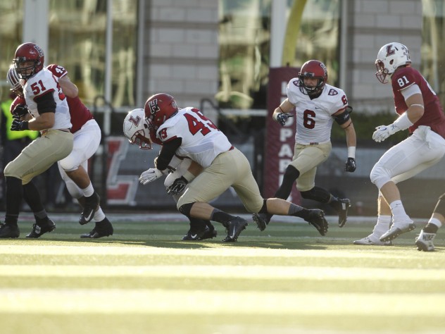 Harvard senior linebacker Eric Medes (49) had a team-high seven tackles and a sack of Leopard quarterback Drew Reed.