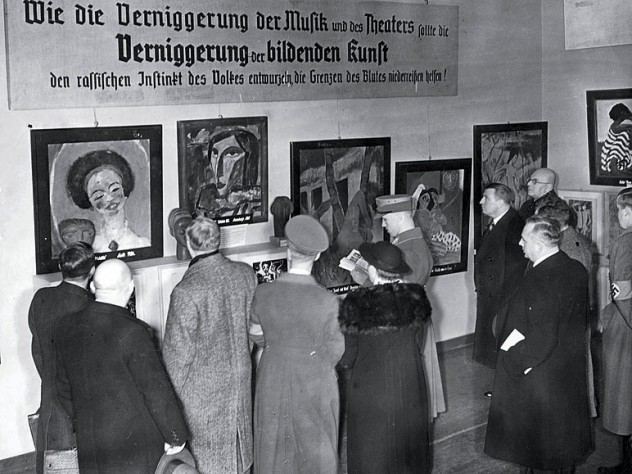 Harvard eventually acquired a Van Gogh self-portrait and the Emil Nolde painting The Mulatto, seen at far left in this photograph of visitors to the Exhibit of Degenerate Art.