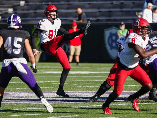 Harvard punter Sean McKeogh punts the ball