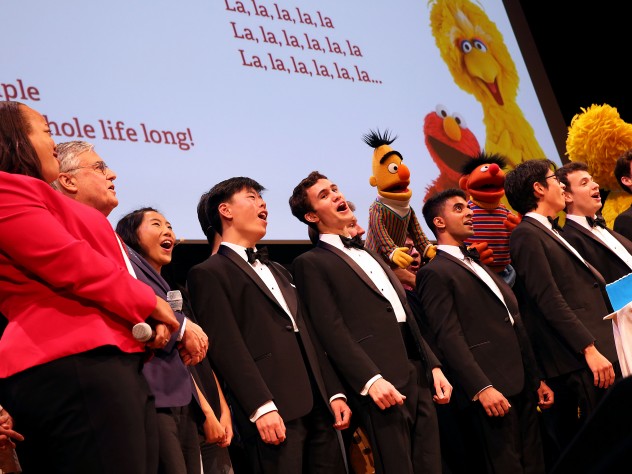 The Harvard Krokodiloes sing with Muppets and Harvard and Sesame Street leaders.