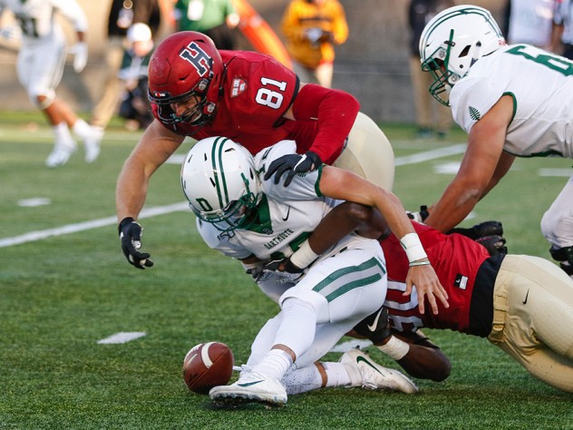 Harvard's Brogan McPartland dives for a loose ball.