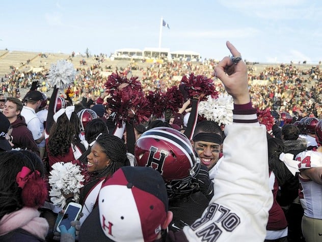 Photographs by Robert Worley Harvard followers stormed the field at Yale Bowl to join players celebrating the Crimson’s seventh straight victory over the Blue.