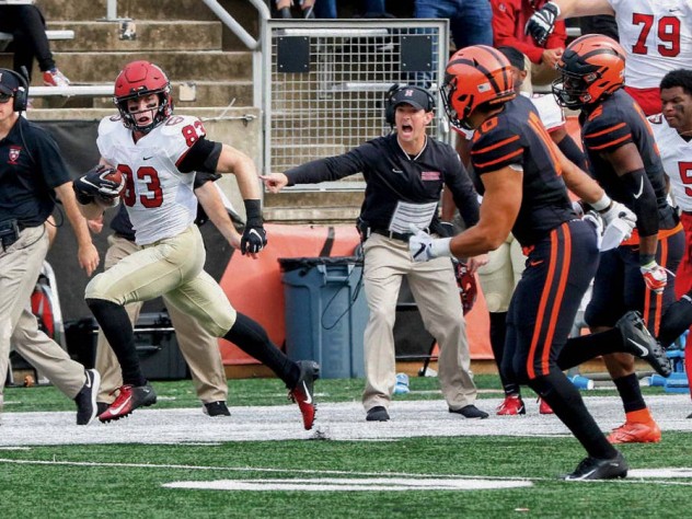 Photograph of Jack Cook setting sail for the Princeton end zone to complete a 73-yard pass-and-run touchdown
