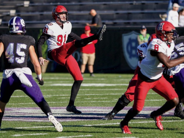 Photograph of outstanding junior punter Sean McKeogh in action against Holy Cross