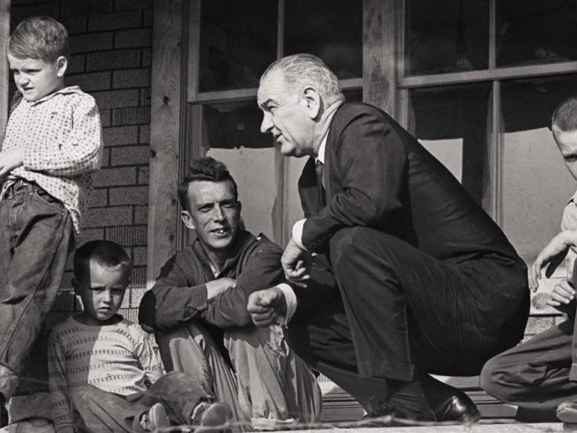 Historic photograph of President Lyndon Johnson meeting with impoverished Fletcher family in Kentucky in 1964
