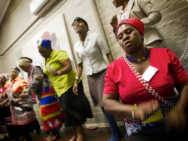Photograph by Nadine Hutton At Edendale Hospital in Pietermaritzburg, South Africa, traditional healers perform a song before telling visitors about their work with iTeach. In the foreground is Makhosi Mbele. (<em>Makhosi</em> is the title used to refer to traditional healers, analogous to "doctor.")