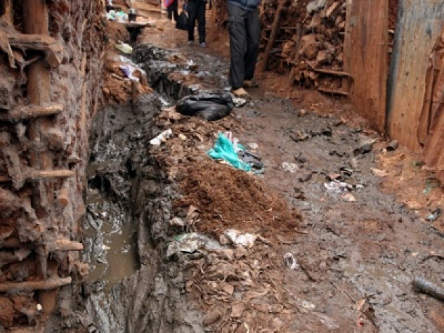 Photograph by Tugela Ridley Walking in Kibera can be treacherous, but those who live or visit there quickly learn the rules of the game: step on dry ground when possible, and keep one’s footing whatever the cost.