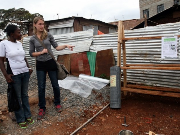 Photograph by Tugela Ridley Nowak discusses the prototype with Faith Mwikali, a social worker who translated for her, introduced her to community members, and helped her conduct her nutritional survey. Mwikali works with Binti Pamoja (“Women Together” in Swahili), a Carolina for Kibera subsidiary that runs programs for women and girls.