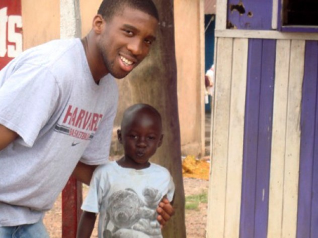 Courtesy of Sangu Delle Visiting in 2008 to oversee construction of a borehole and latrines, Ndu Okereke ’10 (Project ACWA finance director, as well as a roommate of Delle and Finkton) hams it up with one of the village children.