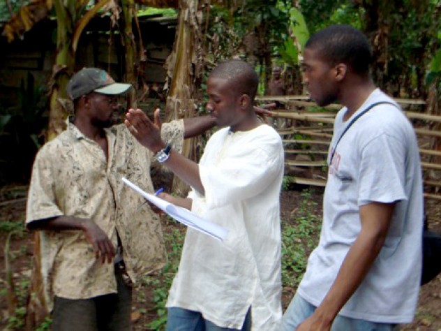Courtesy of Sangu Delle Delle, who grew up in Accra (24 kilometers south of Agyementi), discusses a latrine site with Okereke (right) and the youth representative from the village.