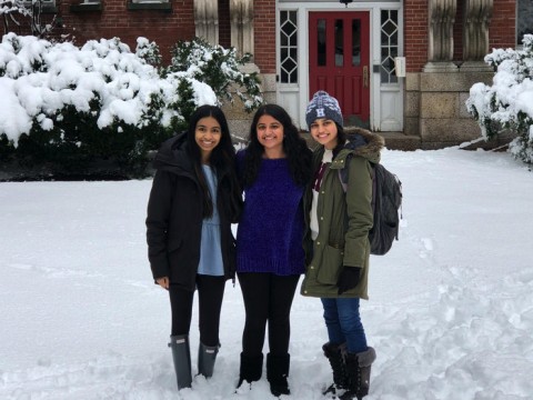The author and her two roommates stand in the snow in front of their future home at Harvard.