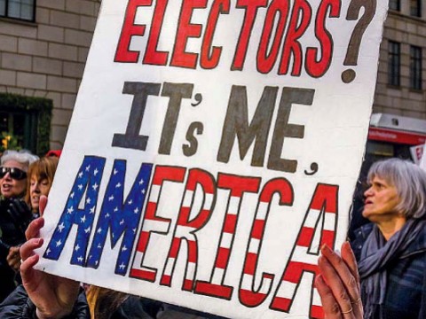 Protestors with a large poster demanding reform of the Electoral College