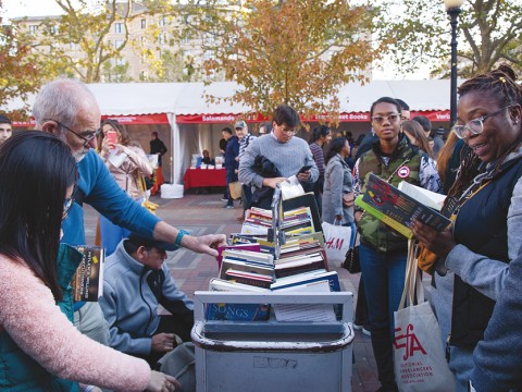 People perusing books outside at the Boston Book Festival 