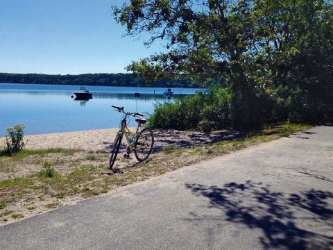 Bike trail scene of Classic Cape Cod sand, water, and sky 