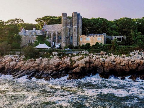Majestic twentieth-century stone castle perched on Gloucester coastline