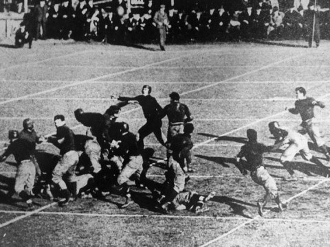 A ball flies through the air off the foot of Vic Kennard.