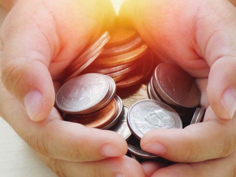 Hands holding coins