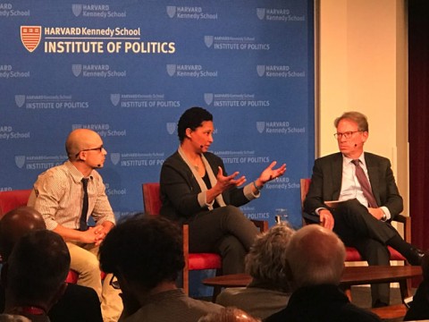 The three panelists on stage at the Kennedy School.
