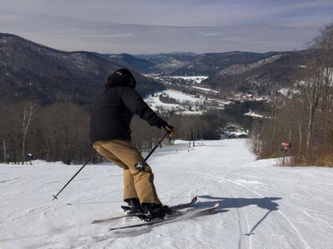 Skier in action at the top of a snow of snow-covered Berkshire East mountain 