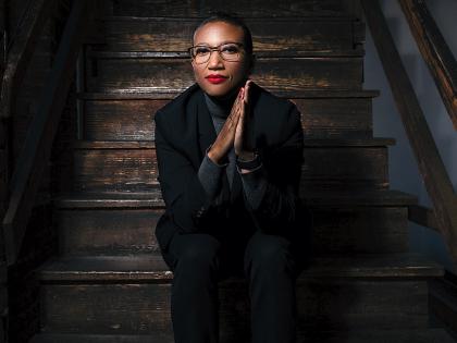 Portrait of Kimberly Dowdell sitting on steps