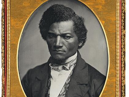 Oval black and white image of Frederick Douglas with gold frame around image