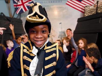 A boy in period military dress