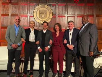 The "Fab Five of Harvard Sports" panelists: (left to right) Ben Crockett ’02, Allison Feaster ’98, Don Sweeney ’88, and Jessica Gelman ’97, M.B.A. ’02, alongside Harvard Club president Marcus O.P. DeFlorimonte PMD '95.