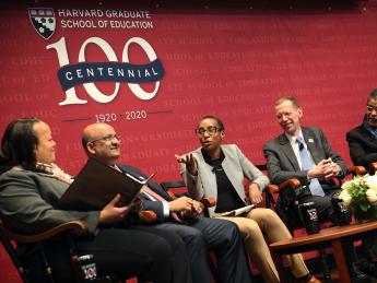 Five Harvard deans sit on stage in a panel.