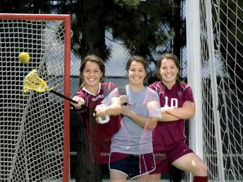 Triple image of a double threat: Baskind stands between her two sports' goals