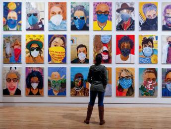 Zoom-like grid of colorful portraits of people in pandemic-era face masks.