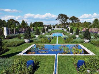 Wide view of blue pools and lawns of the Blue Garden 