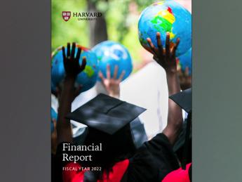 Cover of Harvard annual financial report 2022, showing graduating student celebrating at Commencement