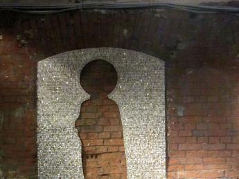 The mosaic <i>Absence</i> (2012) on a wall in Moscow