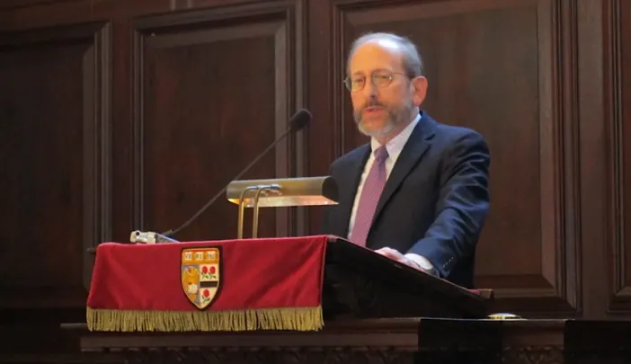 Harvard President Alan Garber at a podium in Memorial Church