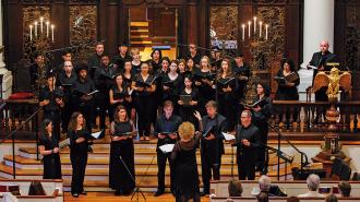 Boston Camerata performing in 2022, with a conductor in front