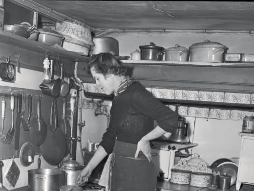 Child in her postwar Paris kitchen