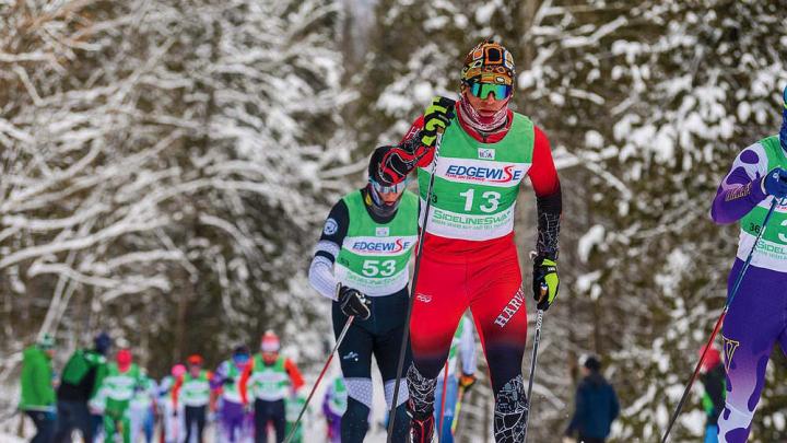 James Kitch on a trail, skiing in front of a competitor