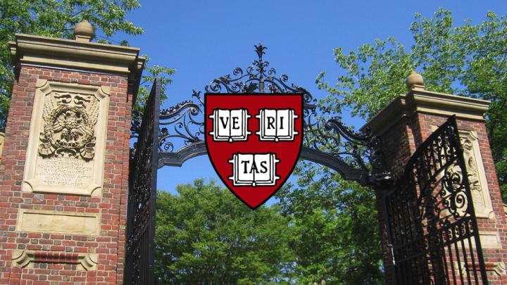 An open gate with the Harvard shield