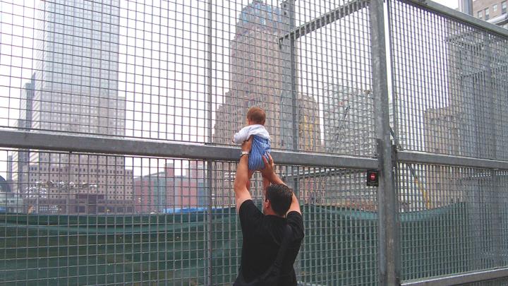 A former resident of the neighborhood and his son revisit the World Trade Center site for the first time. 