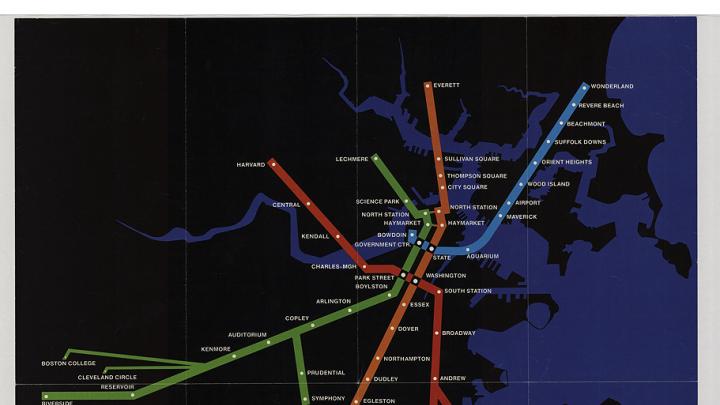 Four brightly colored Boston subway lines superimposed on a black, undetailed map outline of the city