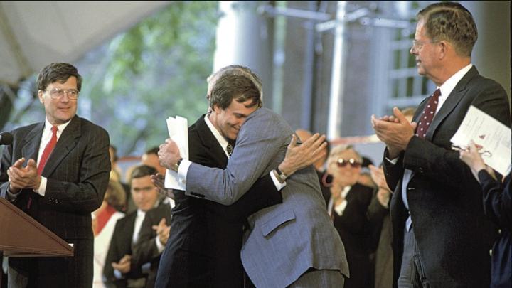 After delivering the Commencement afternoon address, retiring President Bok is hugged by president-elect Neil Rudenstine (1991).