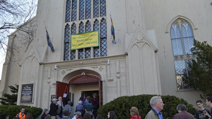 Attendees line up outside the First Parish in Cambridge for Sunday's launch event.