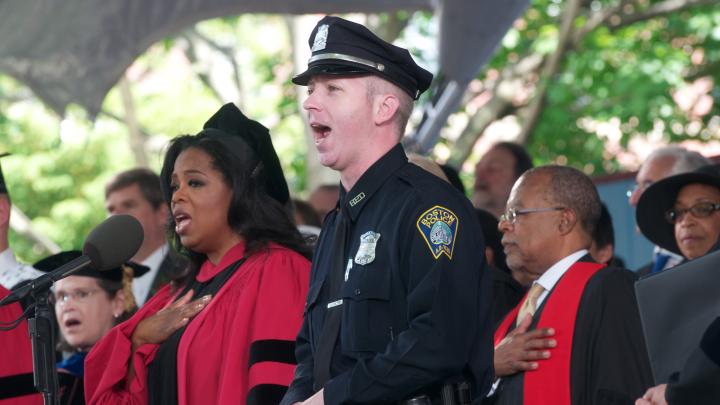 Boston police officer Stephen McNulty led the singing of the National Anthem.