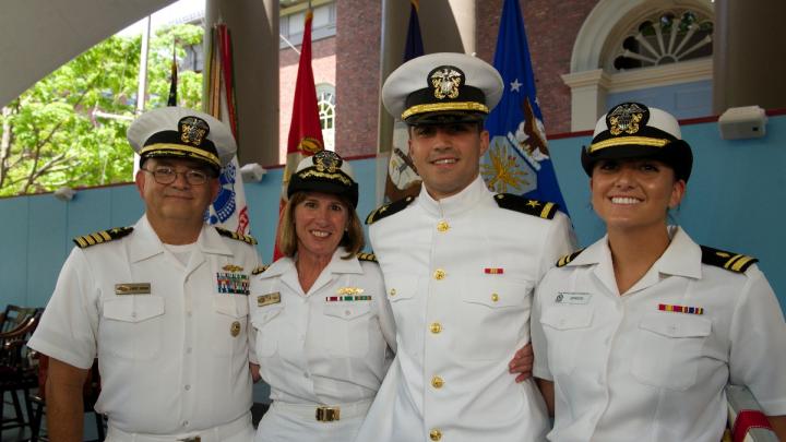 Navy ensign Adam Gracia’s sister, Alexandra (at right), administered his oath of office, and his parents pinned on his insignia. 