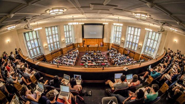 Photo of Yale students attending CS50 in the Yale Law School auditorium