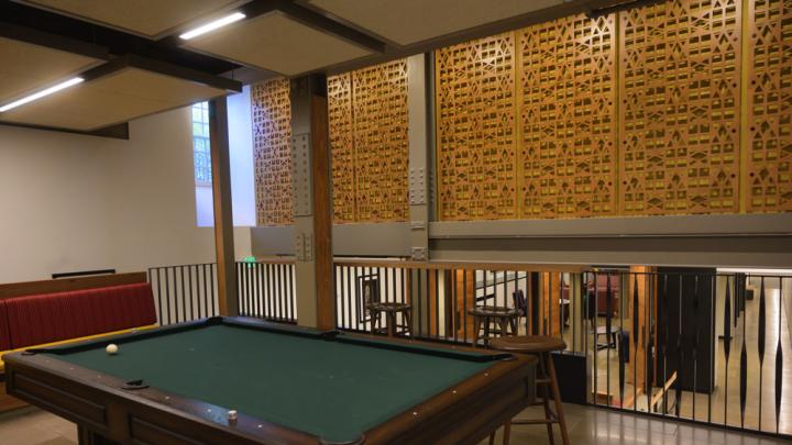 A multi-level common with a pool table in front