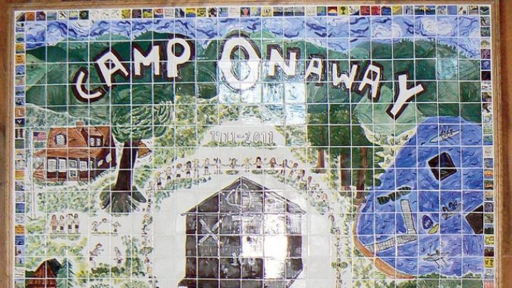 A mural designed by 2011 campers to celebrate Onaway’s centennial summer by highlighting its many traditions