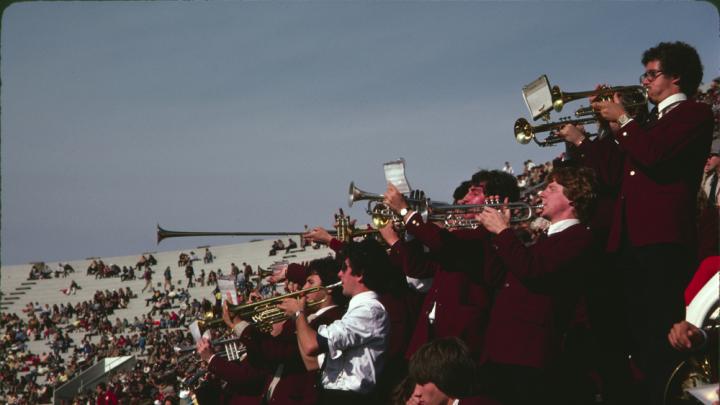 The trumpet section leads a cheer
