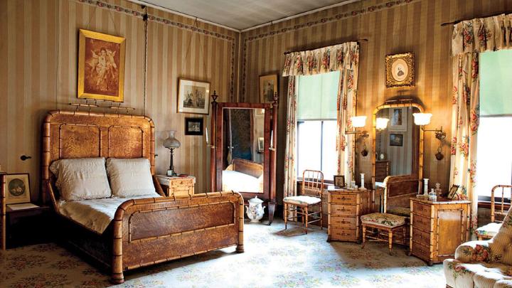 Rosamond Gibson&rsquo;s bedroom, which was redecorated by her mother in 1871, features soft colors, family portraits, and a 15-piece bird&rsquo;s-eye maple bedroom set carved to look like bamboo.